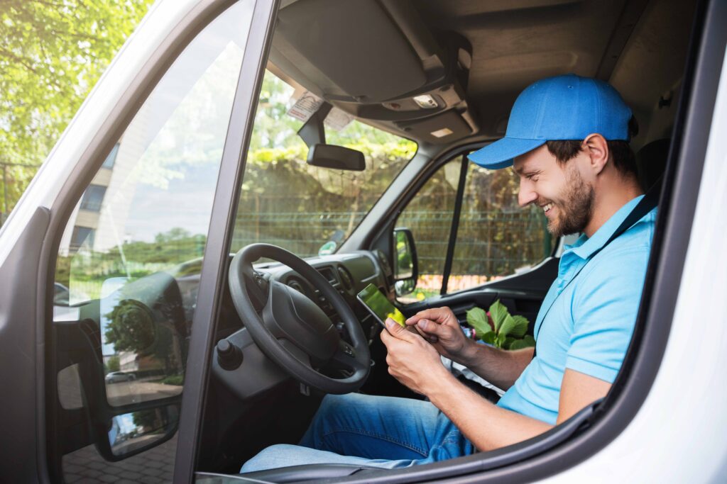 delivery driver using ezbz app on mobile device to keep track of time in and out of jobs